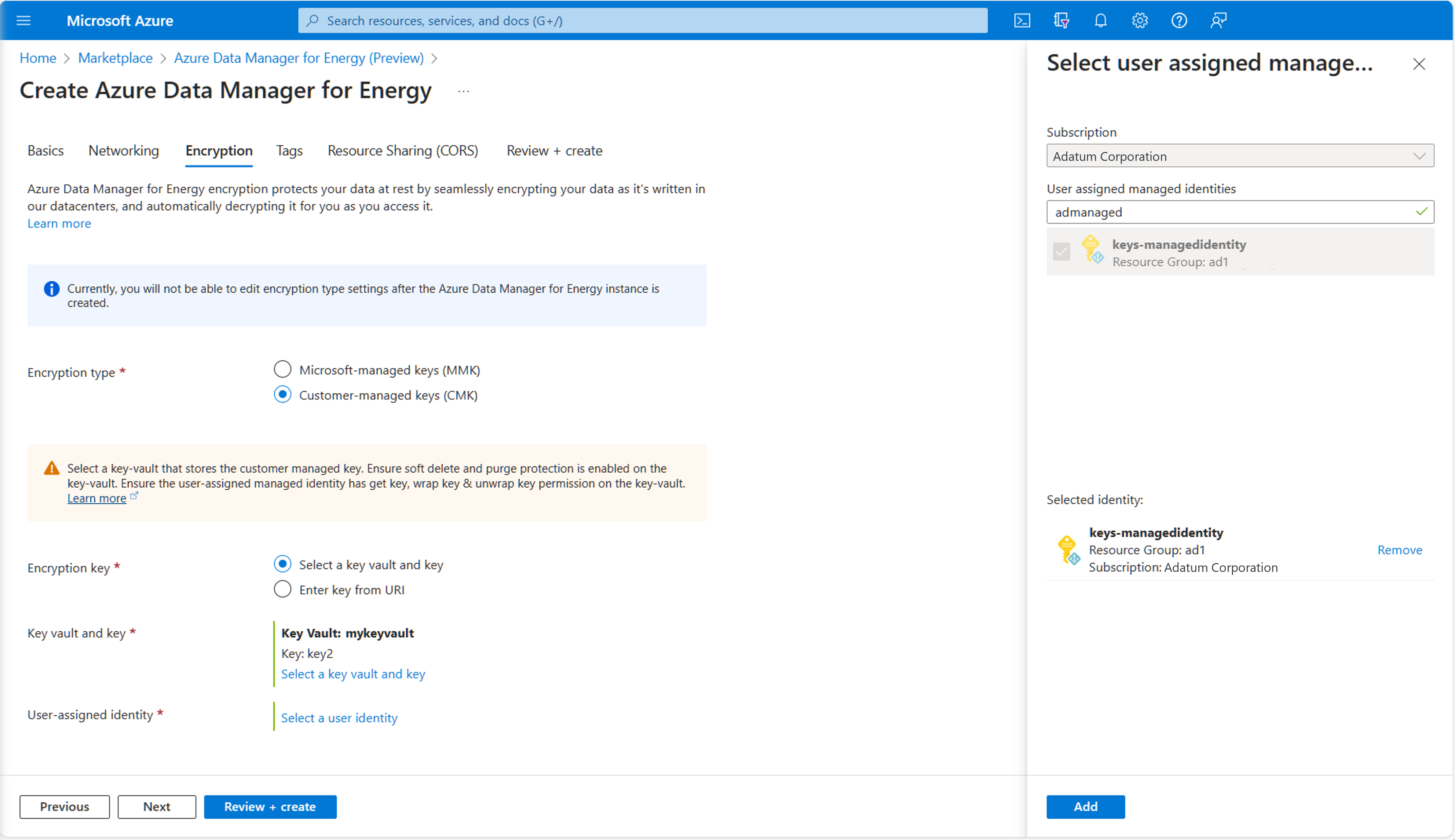 Screenshot of key vault, key, user assigned identity, and CMK on encryption tab.