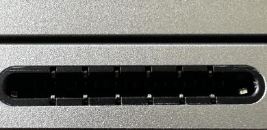 Screenshot that shows inserting the Surface Connect cable connector into the motherboard receptacle and closing the latch