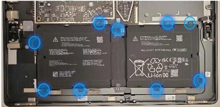 Screenshot that shows nine battery frame screws highlighted before frame removal.