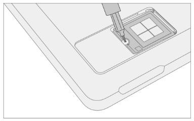 Screenshot that shows removing the rSSD retention screw with a 3IP driver before lifting the drive.