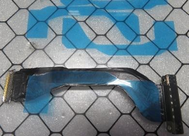 Screenshot that shows applying new adhesive sheet to the back of the Surface Connect Port before reinstall.