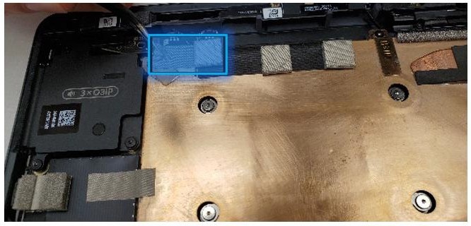 Screenshot that shows tape and foam spanning the button PCB and thermal module before removal on business editions.