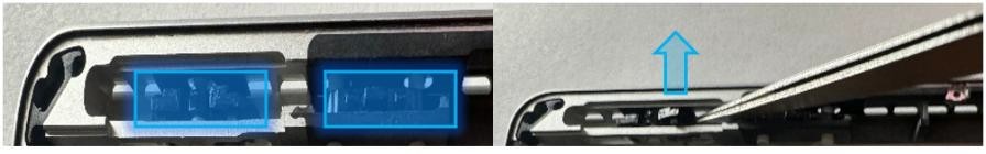 Screenshot that shows prying up one of the plastic button retaining clips using a spudger.