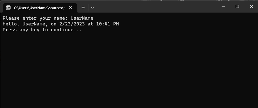 显示调试控制台窗口的屏幕截图，其中显示了“请输入姓名”、“日期和时间”和“按任意键继续”消息。